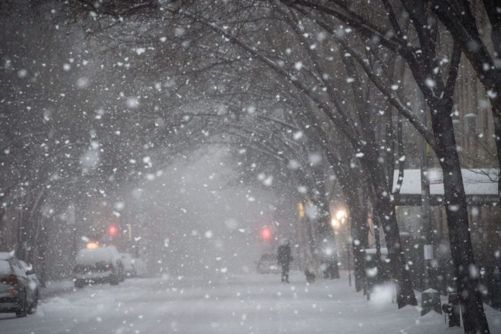 A snowy walkway demonstrating a common winter weather hazard that requires clearing for safety.